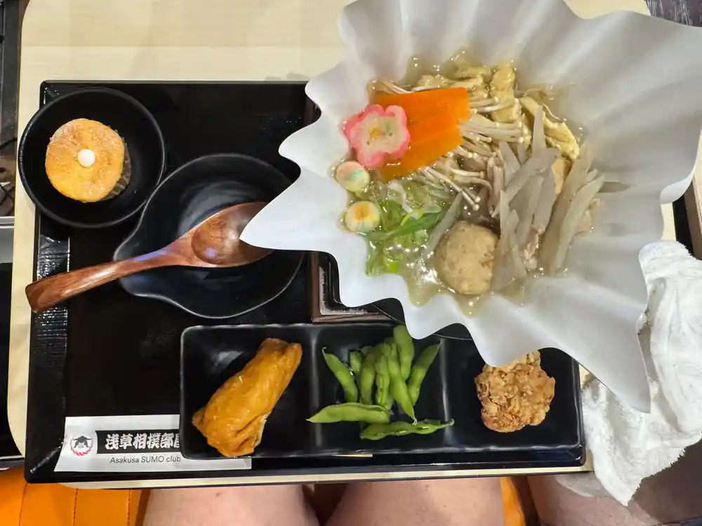 Japanese meal in black lacquered tray with compartments