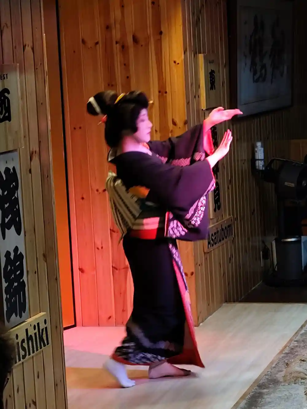Person in traditional Japanese clothing performing martial art