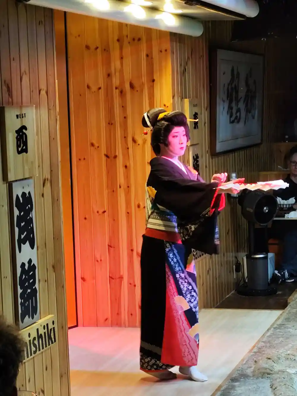 Person in traditional Japanese costume striking martial pose