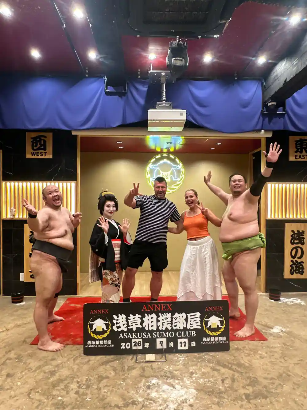 Sumo wrestlers and guests celebrating at tournament