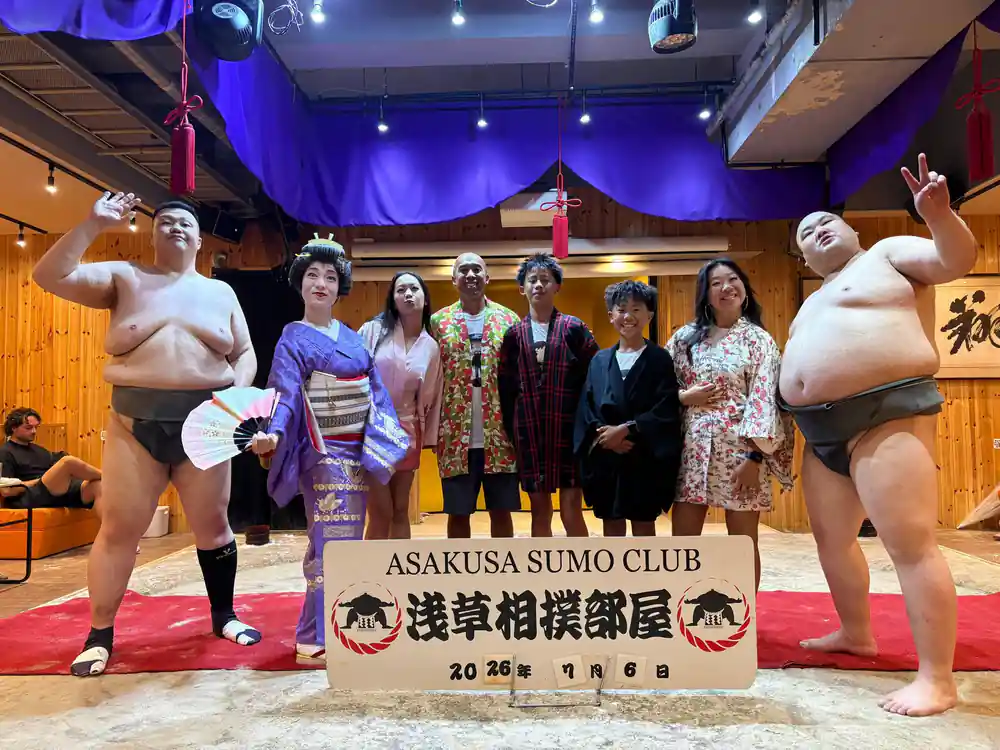 Sumo wrestlers with spectators at Asakusa Sumo Club